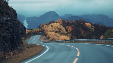 The-two-lane-road-leading-through-the-northern-autumn-landscape
