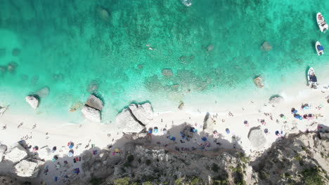 Aerial-top-down-drone-video-of-tropical-paradise-turquoise-beach-in-the-mediterranean,-Sardinia