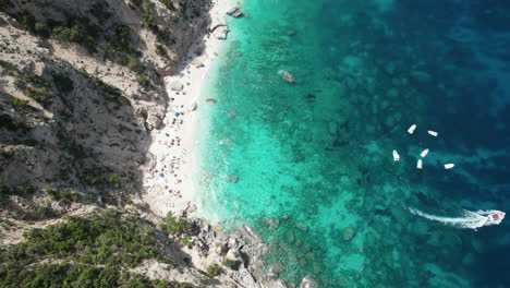 Aerial-top-down-drone-video-of-tropical-paradise-turquoise-beach-in-the-mediterranean,-Sardinia,-Costa-Azzurra