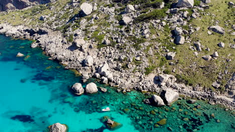 Small-leisure-boat-anchored-in-idyllic-turquoise-Mediterranean-Sea