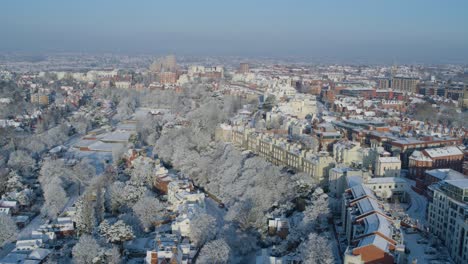 Aerial-pull-back-establishing-shot-of-Nottingham-residential-houses-covered-in-snow