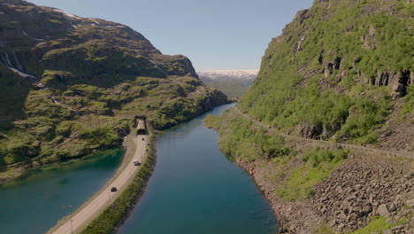 Vehicles-drive-through-a-tunnel-near-Roldasfjellet-mountain,-Norway