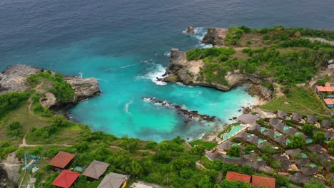 extremely-turquoise-tropical-water-at-Blue-Lagoon-at-Nusa-Ceningan-Island,-aerial