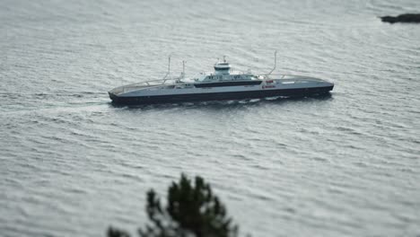 A-big-ferry-is-passing-in-the-fjord-Tilt-shift-video,-slow-motion