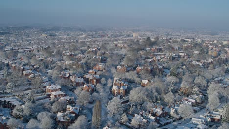 Pull-back-aerial-establishing-shot-of-Nottingham-residential-streets-during-winter