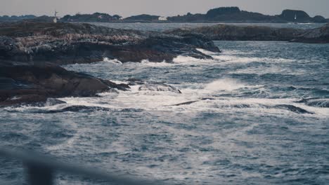 Powerful-waves-are-crashing-on-the-rocky-shores-near-the-Atlantic-road,-in-Norway