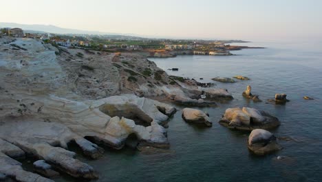 Aerial-of-sunset-at-the-unique-phenomenon-of-sea-caves-of-Peyia-Cyprus