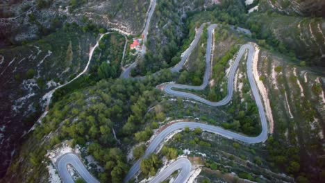 Aerial-view-of-a-hairpin-bend-in-troodos-mountrains,-Cyprus