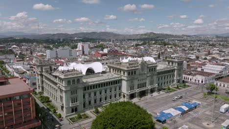Wide-aerial-footage-of-the-Palacio-Nacional-de-la-Cultura-in-Guatemala-City,-Guatemala