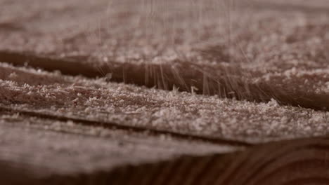 Macro-Of-Wood-Shavings-Fall-While-Cutting-Wood-At-The-Workshop