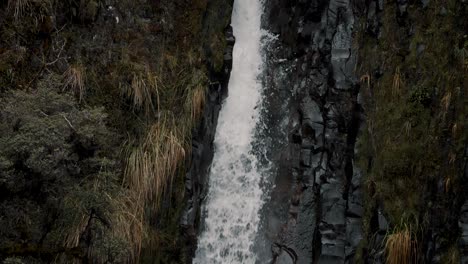 Slow-Motion-Of-Waterfall-Cascading-On-Rocky-Cliff-At-The-Cayambe-Coca-Ecological-Reserve-In-Napo,-Ecuador