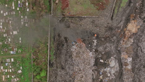 Top-down-aerial-footage-of-a-fire-burning-in-a-landfill