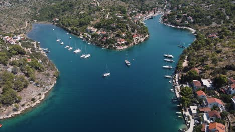 Popular-sailing-anchorage-Bobovisca-viewed-from-birds-eye-view,-orbit-drone-shot-in-the-summertime,-Brac-Island,-Croatia,-Adriatic-Sea