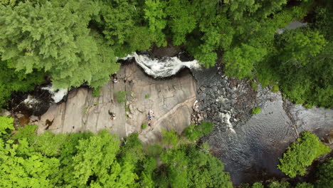 Aerial-view-of-a-waterfall-flowing-down-through-a-forest-at-Stubb’s-Falls-at-Arrowhead-Park,-Ontario,-Canada