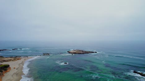 Aerial-Drone-Rotation-Of-San-Gregorio-State-Beach-off-the-Pacific-Coast-Highway-in-California,-United-States