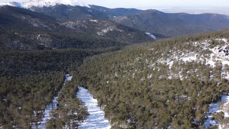 Imposing-view-of-the-Guadarrama-mountain-range-area-in-Madrid,-Spain,-with-a-beautiful-snowy-forest