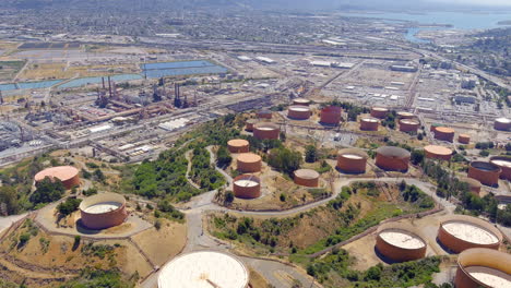 Aerial-View-Of-Circular-Tanks-Near-The-Industrial-Area-Of-Dutra-Materials,-An-Asphalt-Contractor-In-California,-USA