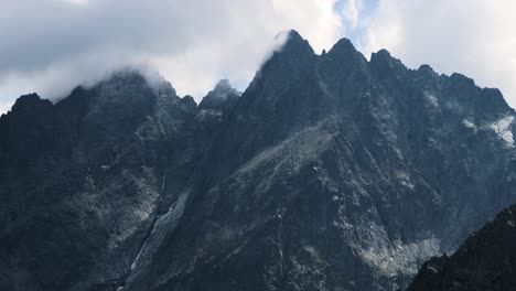 Dramatic-Misty-High-Mountain-Peaks-Telephoto-Closeup-By-Clouds-Covered-in-High-Tatras