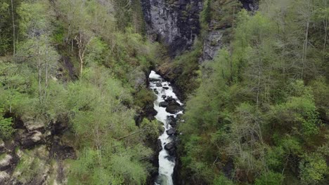 Aerial-flying-inside-Bordalsgjelet-gorge-in-Voss-Norway---Flying-above-river-in-popular-tourist-attraction
