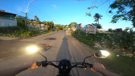 Motorbike-Rider-Traveling-On-The-Road-In-Mui-Ne,-Vietnam