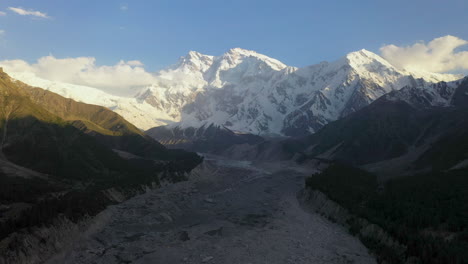 Wide-drone-shot-of-Nanga-Parbat-with-a-glacier-in-valley,-Fairy-Meadows-Pakistan,-cinematic-wide-revealing-aerial-shot
