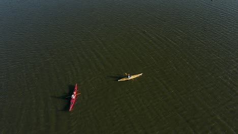 Kayaks-in-calm-water-on-the-lake,-aerial-view