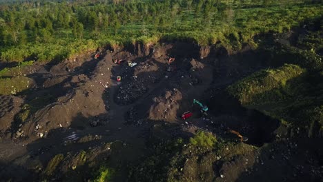 Aerial-top-down-shot-of-working-illegal-on-sand-mine-and-destroying-forest-woodland-in-Asia