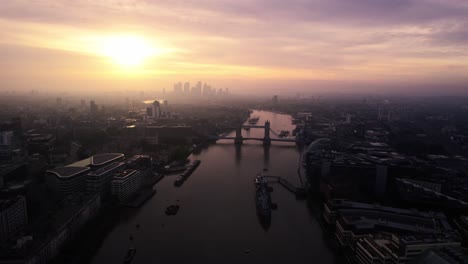 Bird's-aerial-drone-view-of-majestic-Tower-Bridge-in-Thames-river,-London,-UK,-sunset