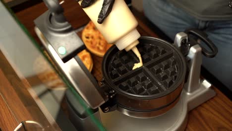 Top-view-of-dough-waffle-maker-oster-gofrera-in-slow-motion