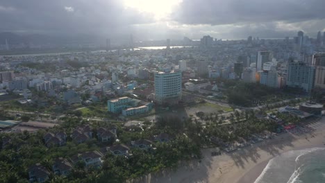 Aerial-view-of-long-white-sand-stretch-My-Khe,-My-Bac-An-and-Non-Nuoc-beach-during-sunset-in-Danang,-Central-Vietnam
