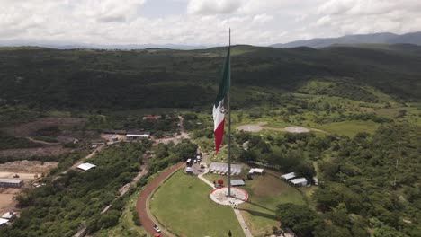 Aerial-orbit-view-around-Mexican-flag-for-Independence-Declaration-in-Iguala