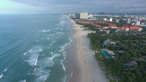 Aerial-view-of-long-white-sand-stretch-My-Khe,-My-Bac-An-and-Non-Nuoc-beach-during-sunset-in-Danang,-Central-Vietnam