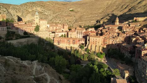 Forward-drone-flight-view-of-Albarracin,-Teruel,-Spain,-one-of-the-most-beautiful-locations-in-Spain,-recorded-in-a-sunny-summer-morning-just-after-dawn