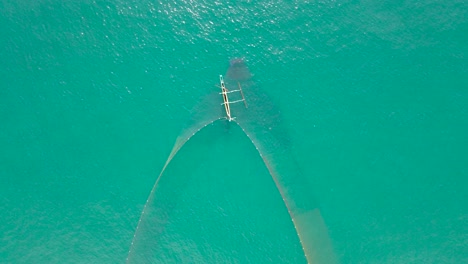 Aerial-Drone-shot-of-Local-Fisherman-Using-The-Oldest-Fishing-Method-in-Sri-Lanka
