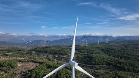 Dramatic-and-stunning-view-over-a-wind-farm-in-green-mountainous-scenery