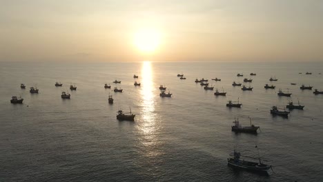 Aerial-Drone-Shot-of-Sri-Lankan-Fishing-Boats-Anchored-at-Sunset