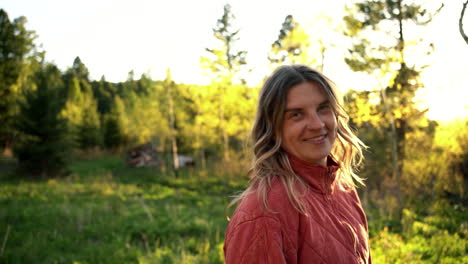 Soulful-content-woman-living-at-countryside-Montana-woods-flipping-hair