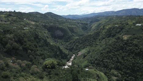 Aerial-Drone-Travel-Above-Magdalena-River,-Green-Valley-in-San-Agustin,-Colombia-Mountain-Vegetation-Natural-Destination-in-Latin-America