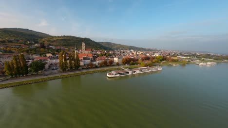 Aerial-landscape-shot-of-the-city-Stein-and-the-Danube,-lower-Austria