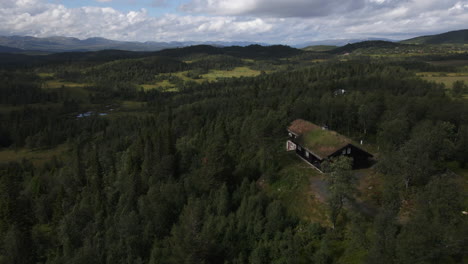 An-aerial-view-of-beautiful-historical-farmhouses-and-granaries-dotting-the-countryside-in-Rauland,-Norway