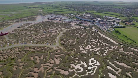 Tollesbury-Marshes-And-Marina-In-Essex,-United-Kingdom---aerial-drone-shot