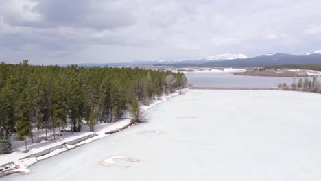 Drone-Aerial-of-the-winter-showing-the-vacation-homes-around-Island-Park-Reservoir-in-Island-Park-Idaho
