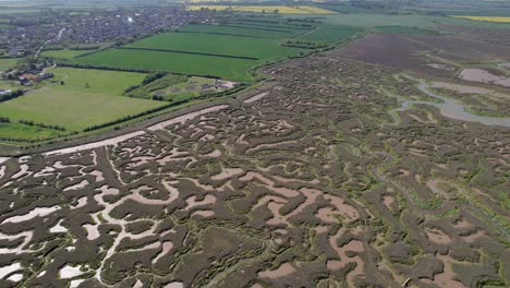 Aerial-Panoramic-View-Of-Salt-Marshes-At-Tollesbury-Marina,-Essex,-United-Kingdom