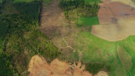 Aerial-Topdown-view-of-cut-down-trees-cleared-land,-deforestation-Ecological-catastrophe