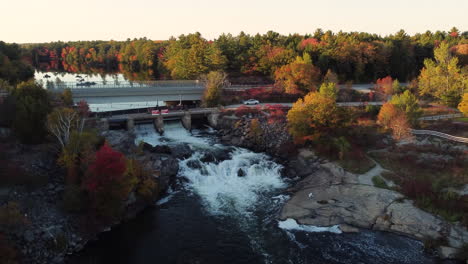 Aerial-of-White's-Falls-surrounded-by-landscape-with-fall-foliage