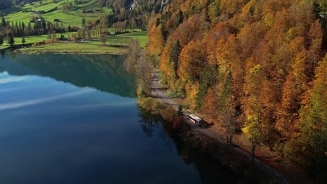 Aerial-view-of-shoreline-of-Klontaler-Lake-in-Switzerland