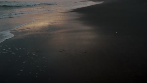 Black-Sand-Beach-Of-El-Paredon-In-Guatemala-At-Sunset---drone-shot