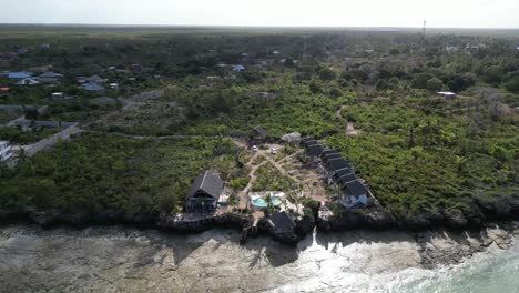 Bungalow-resort-in-Kusini-beach-East-Zanzibar-Island-Tanzania-Africa,-Aerial-orbit-left-shot