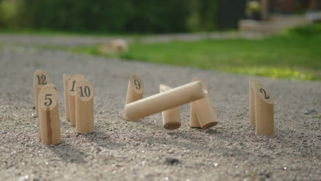 Mölkky---A-finnish-wooden-throwing-game-played-on-cottage-yard-during-a-summer-day---Slow-motion