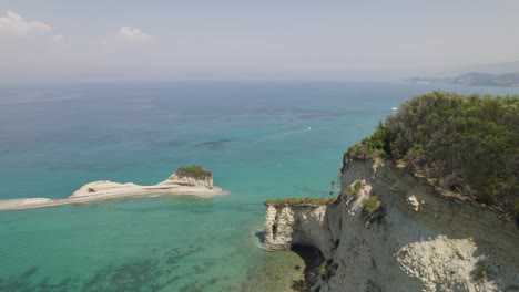 Drone-flight-along-imposing-sandstone-sea-cliffs-on-Sidari-coastline,-Corfu